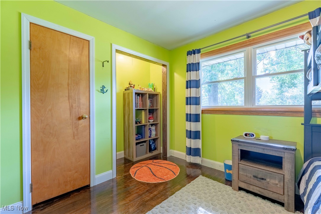 6245 Firestone Road Northeast Canton, OH 44721 - Photo 18 of 33 Rec room with wood finished floors and baseboards