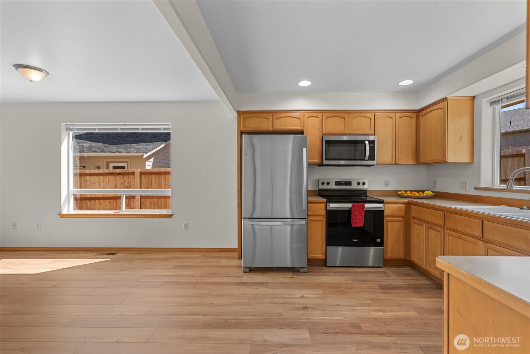 1111 Splett Street Wenatchee, WA 98801 - Photo 14 of 36 a kitchen with stainless steel appliances granite countertop a refrigerator and a stove top oven
