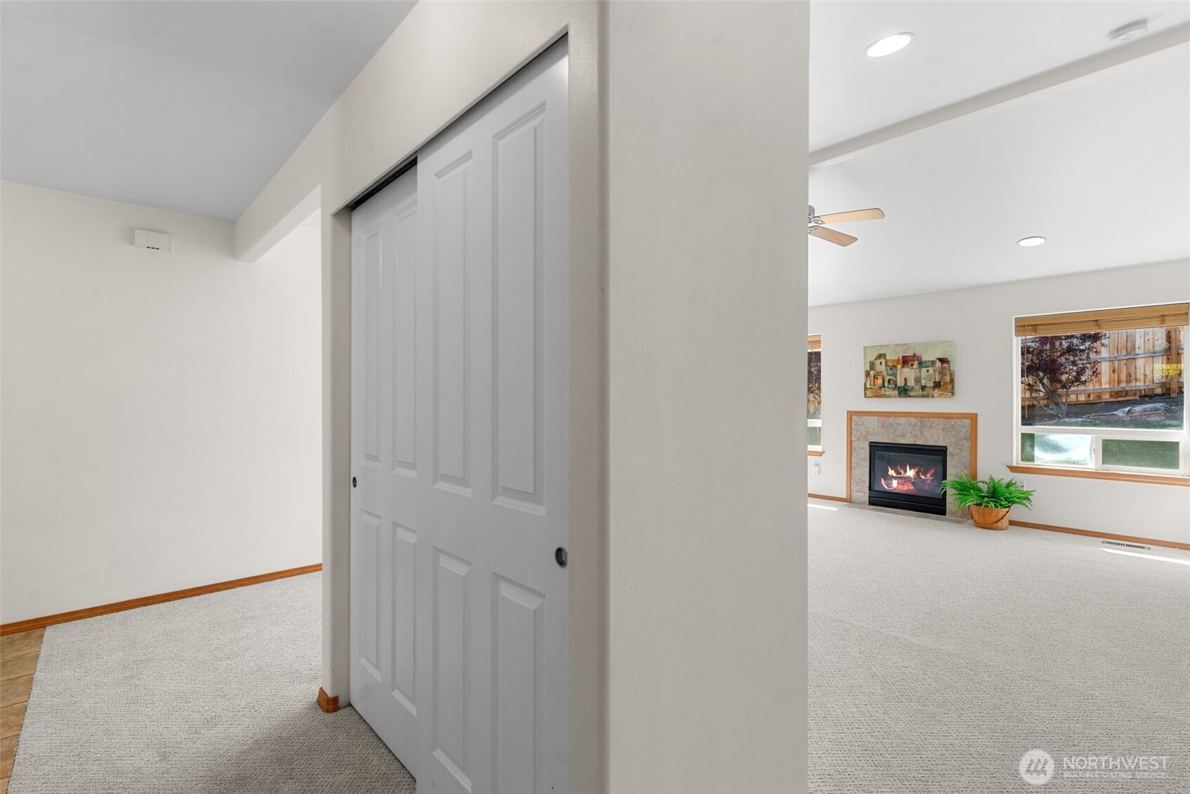 1111 Splett Street Wenatchee, WA 98801 - Photo 29 of 36 a view of a livingroom with a fireplace a hallway and a window