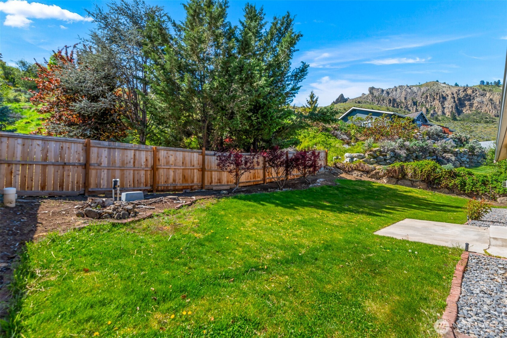 1111 Splett Street Wenatchee, WA 98801 - Photo 30 of 36 a view of a backyard with a garden