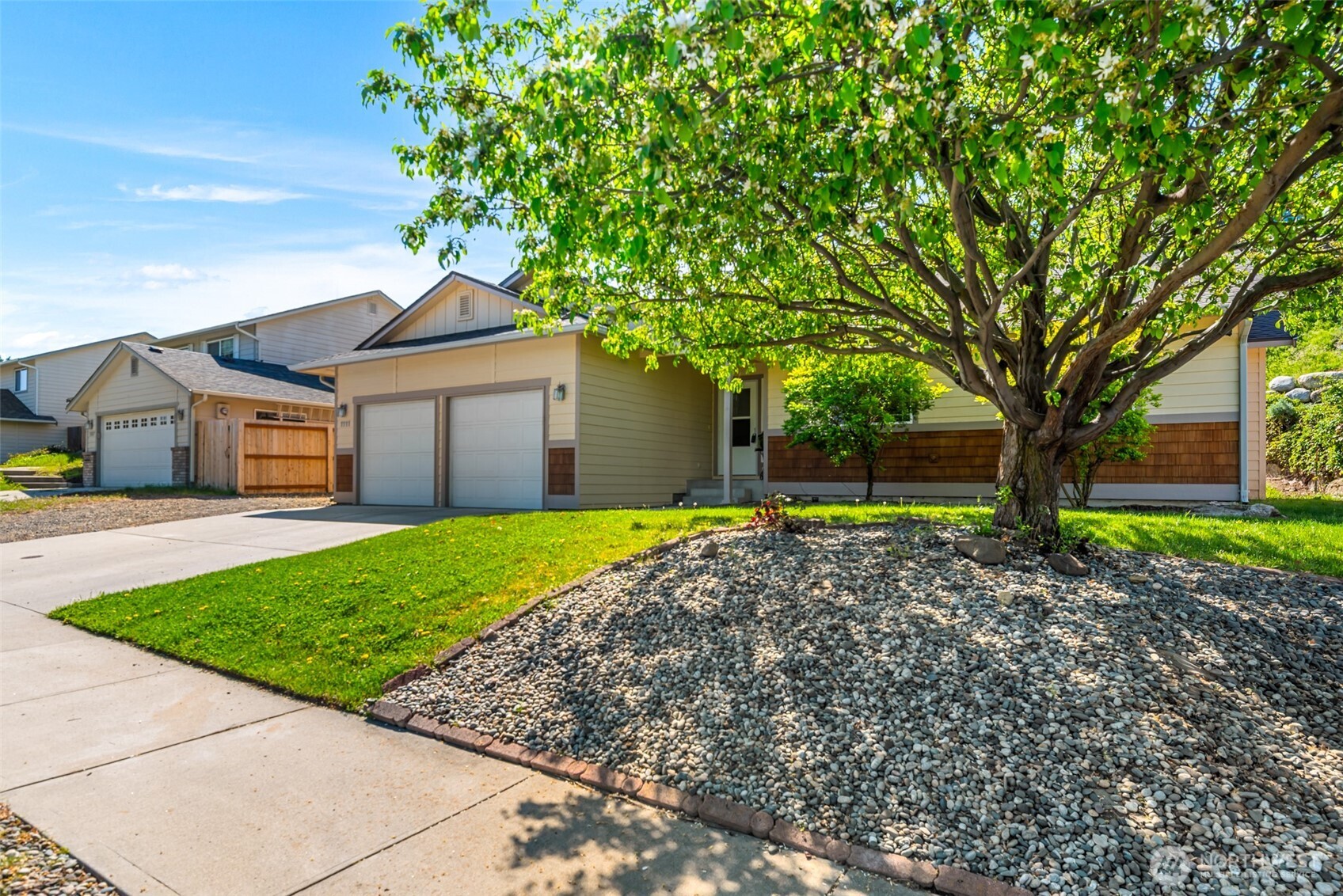 1111 Splett Street Wenatchee, WA 98801 - Photo 3 of 36 a view of a house with a small yard and large tree