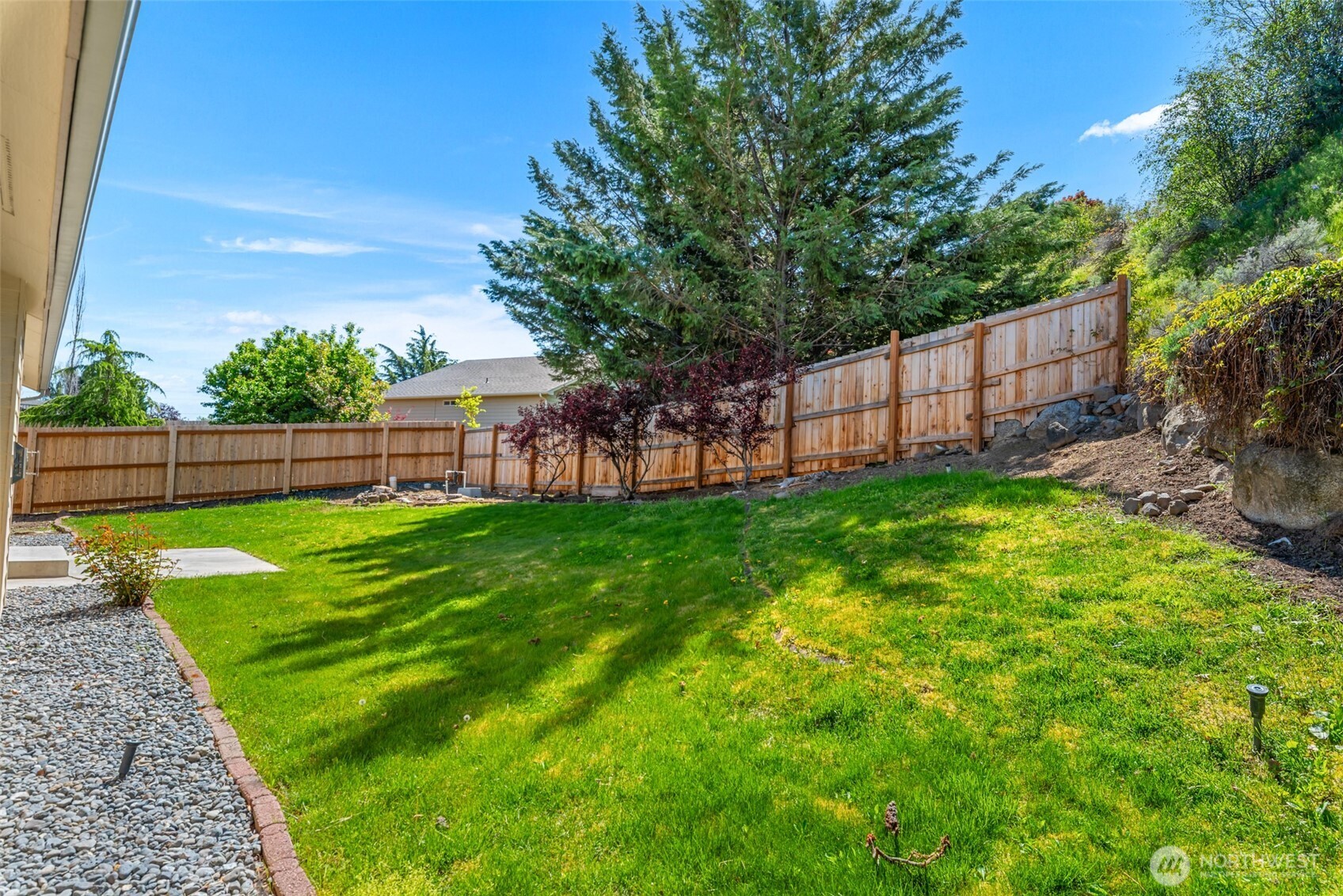 1111 Splett Street Wenatchee, WA 98801 - Photo 34 of 36 a view of yard with green space and wooden fence