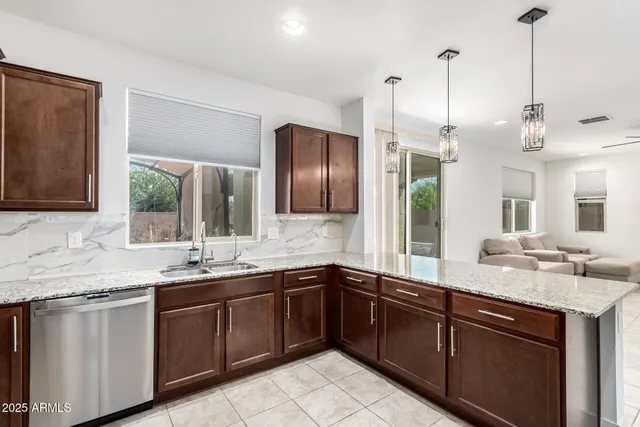 a kitchen with a sink and stove