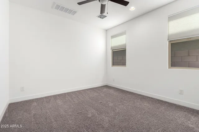 an empty room with closet area
