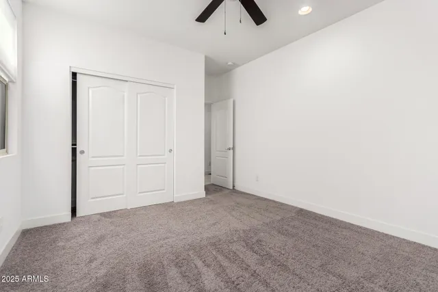 a bathroom with a sink a toilet a mirror and shower