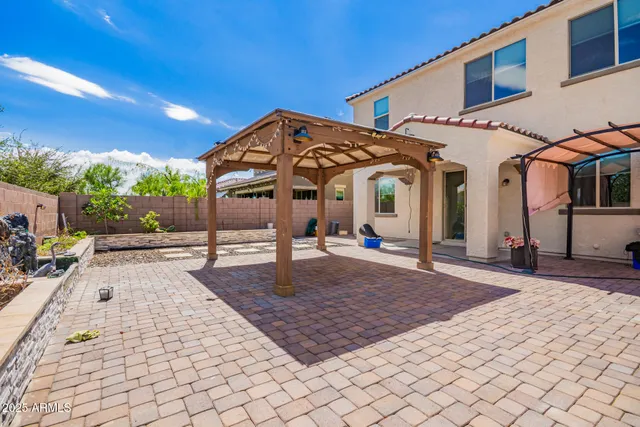 a view of a couches and table in the patio