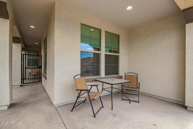 a couple of chairs in front of a door
