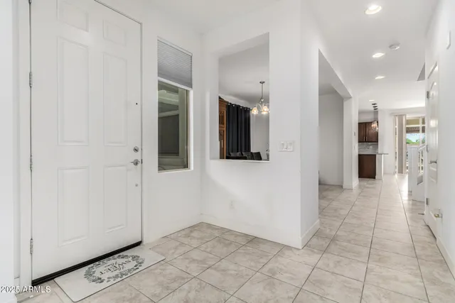 a view of a hallway with wooden shelves