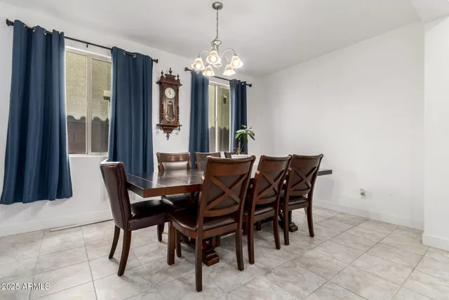 a view of a dining room with furniture and window