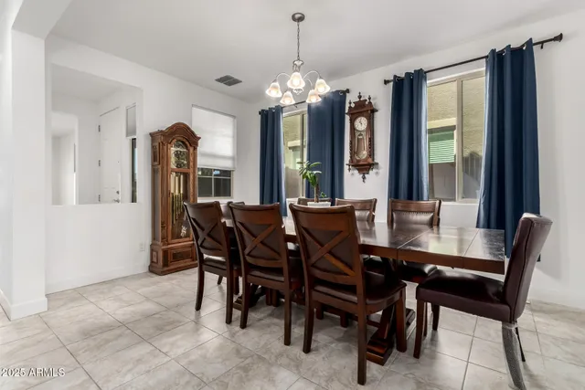 a view of a dining room with furniture and window