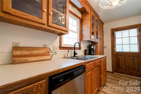 a kitchen that has a sink and a stove