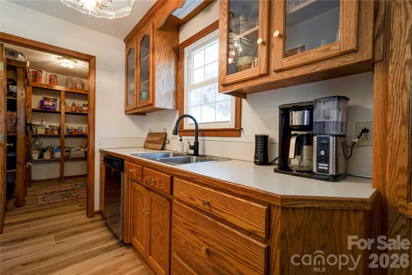 a kitchen with stainless steel appliances granite countertop a sink and cabinets