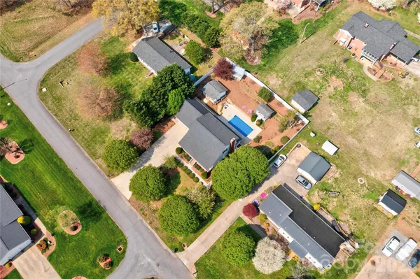 an aerial view of residential house with outdoor space and swimming pool