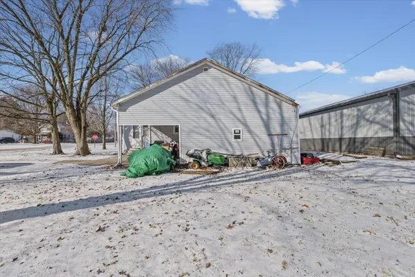 a view of a dirt road and a building