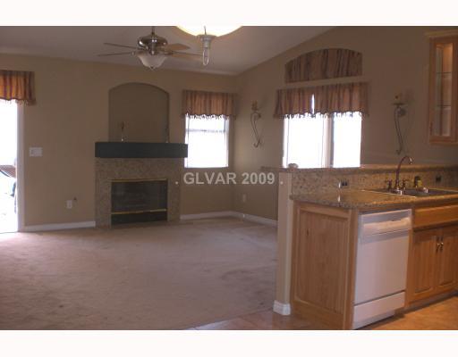 929 Longshanks Road Henderson, NV 89015 - Photo 5 of 7 Den. FAMILY RM WITH GRANITE BACKED FIREPLACE AND CEILING FAN.
