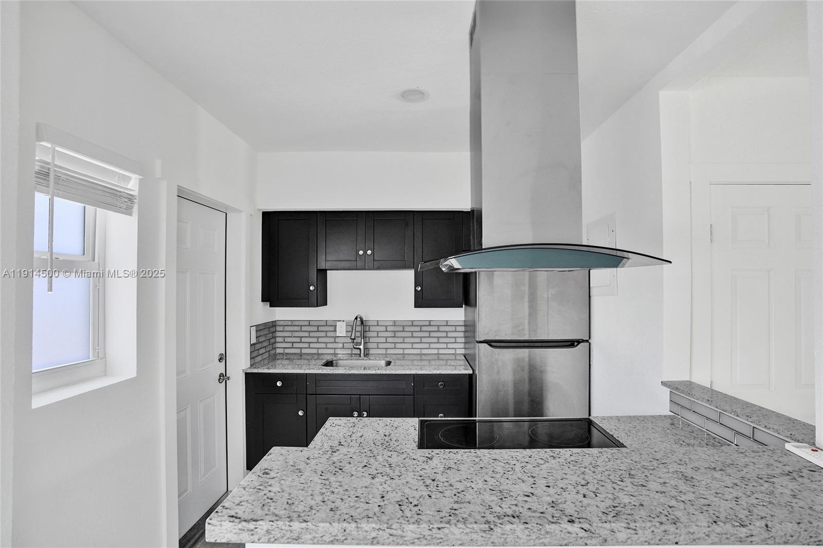 7115 Rue Granville, Unit C Miami Beach, FL 33141 - Photo 17 of 25 a view of workspace with wooden floor