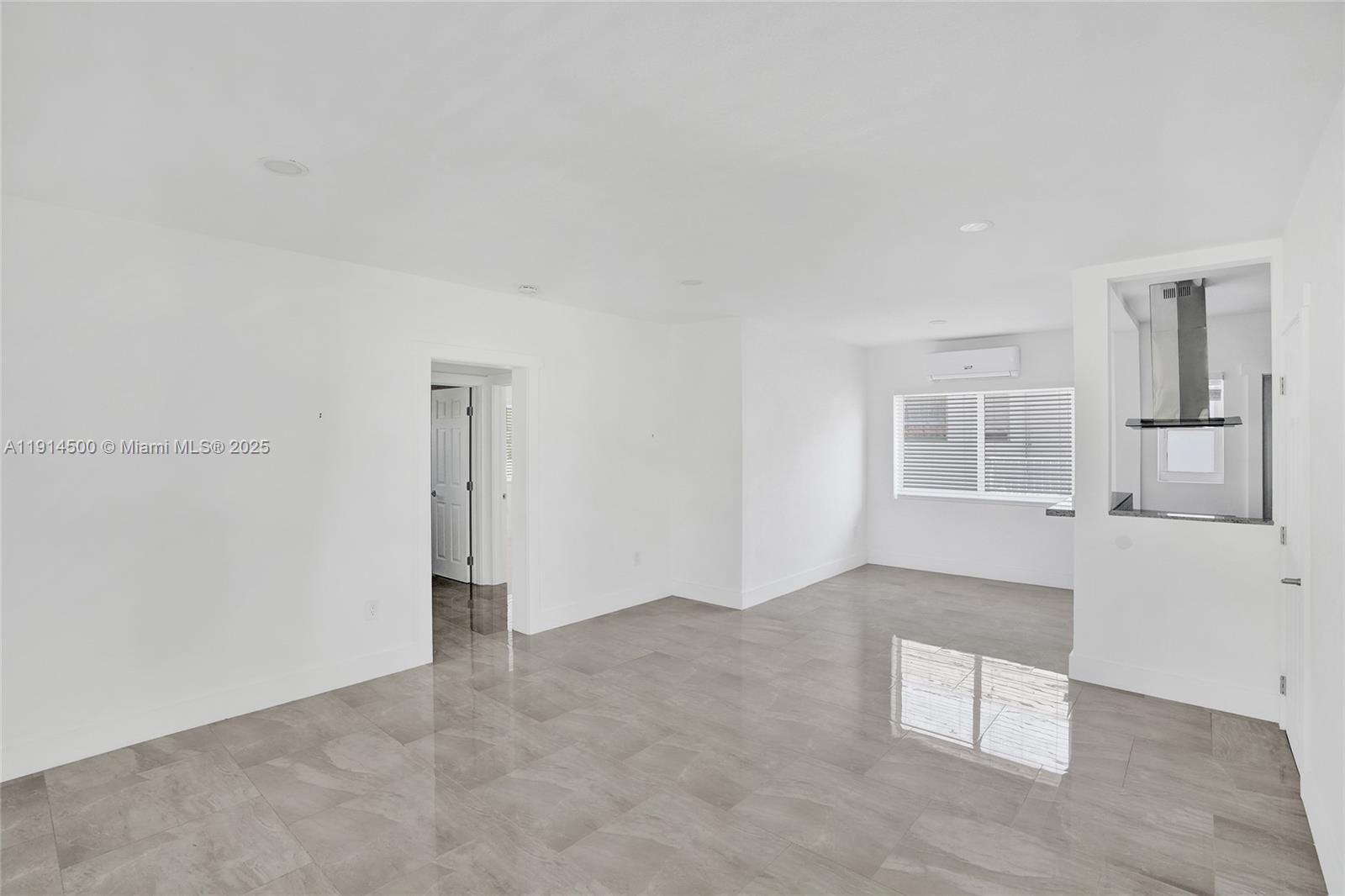 7115 Rue Granville, Unit C Miami Beach, FL 33141 - Photo 8 of 25 an empty room with windows