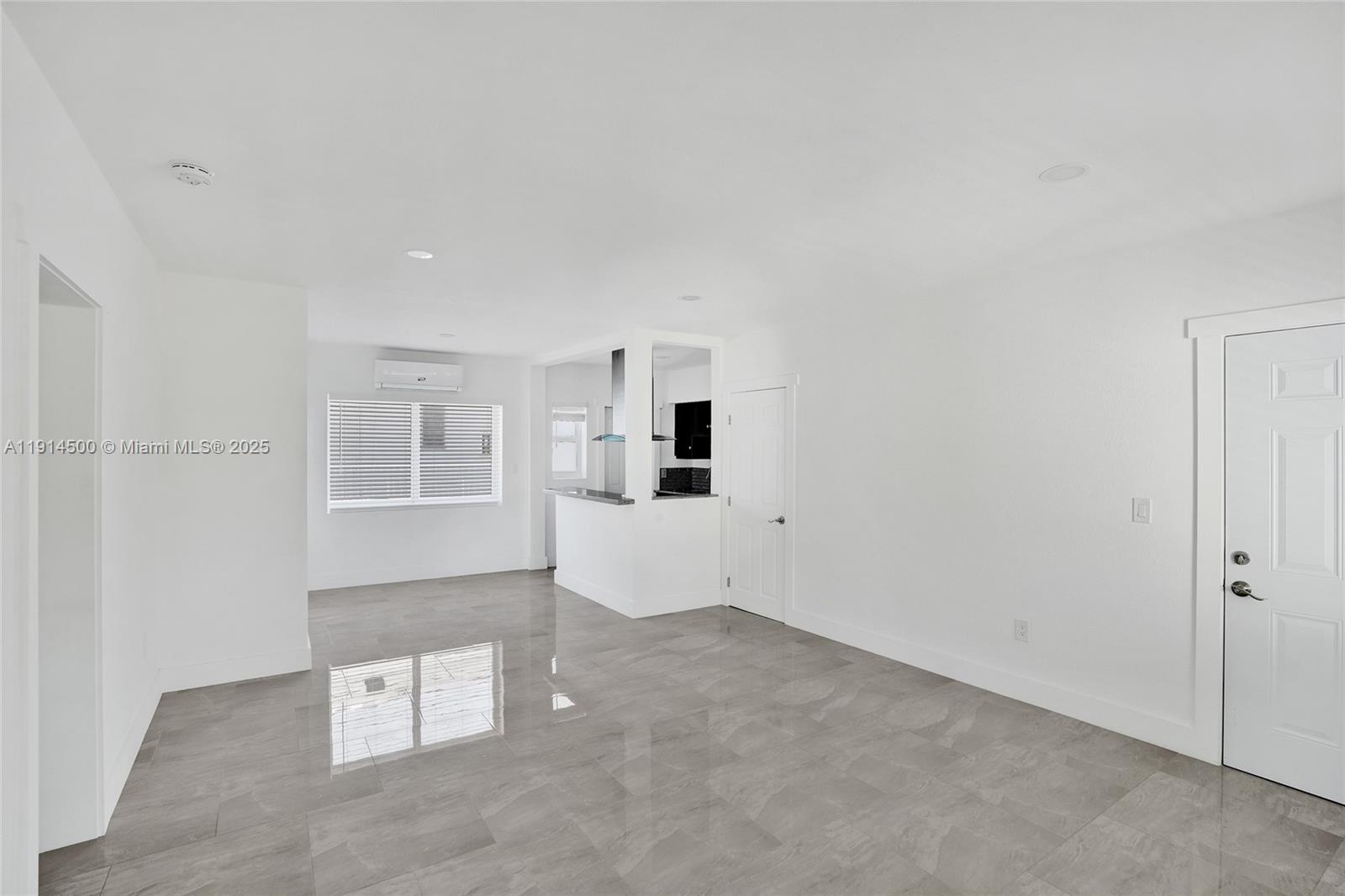 7115 Rue Granville, Unit C Miami Beach, FL 33141 - Photo 9 of 25 an empty room with windows