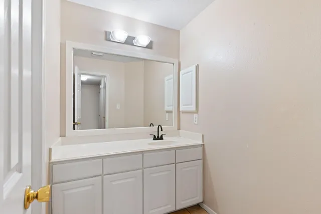 a bathroom with a sink and a mirror