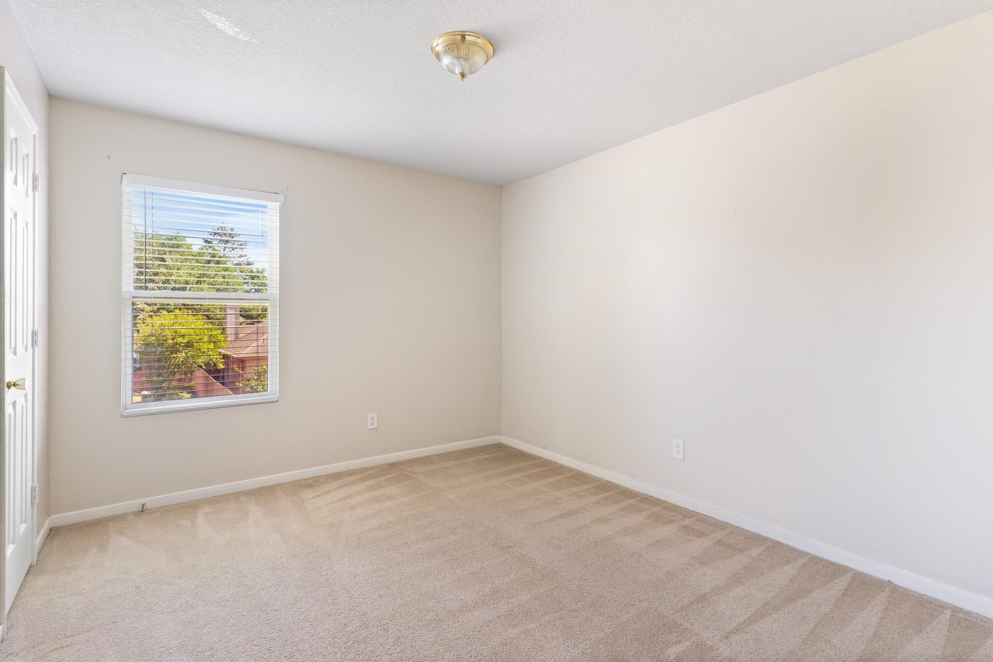 5038 Forest Hurst Drive Spring, TX 77373 - Photo 20 of 22 an empty room with windows