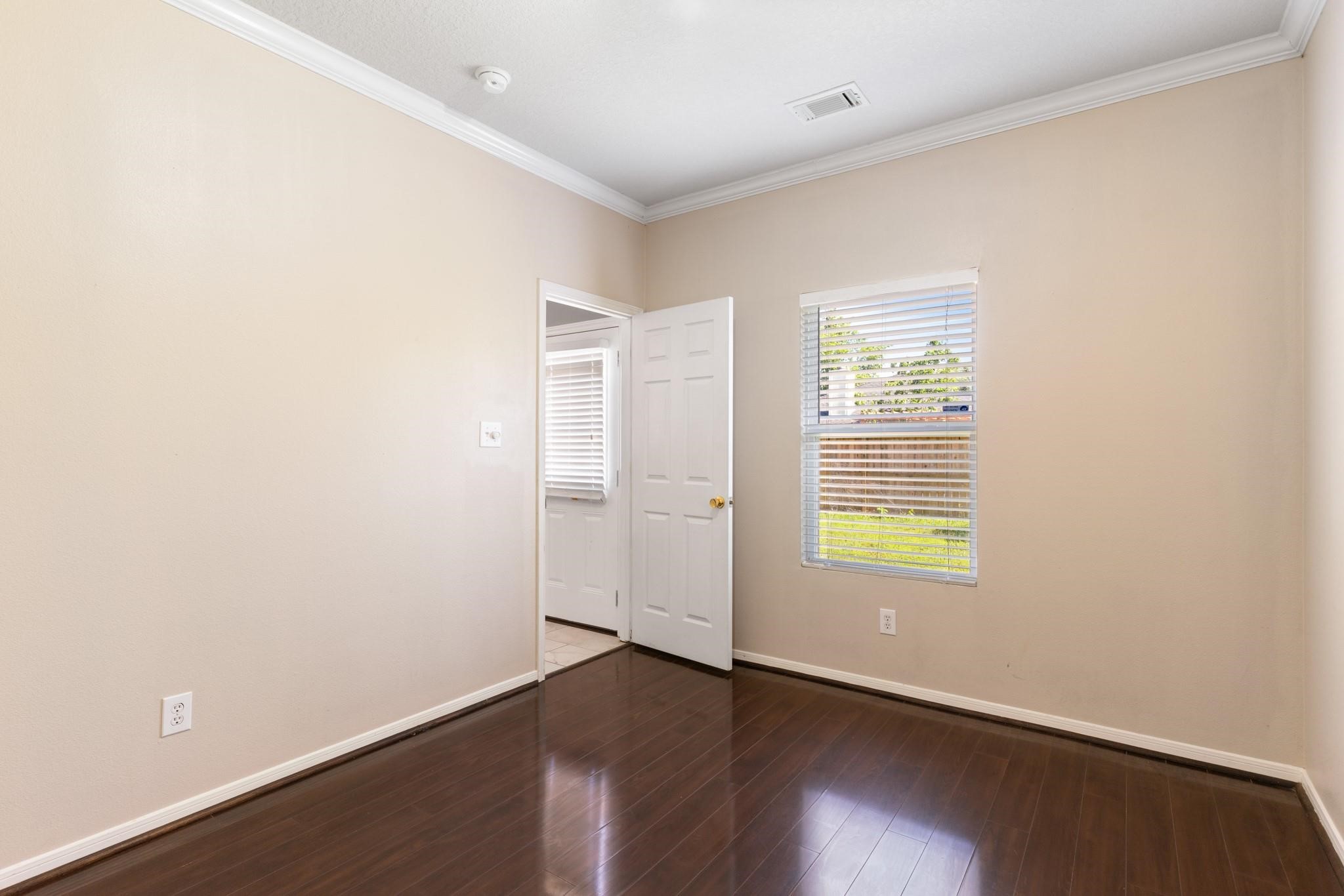 5038 Forest Hurst Drive Spring, TX 77373 - Photo 4 of 22 an empty room with wooden floor and windows