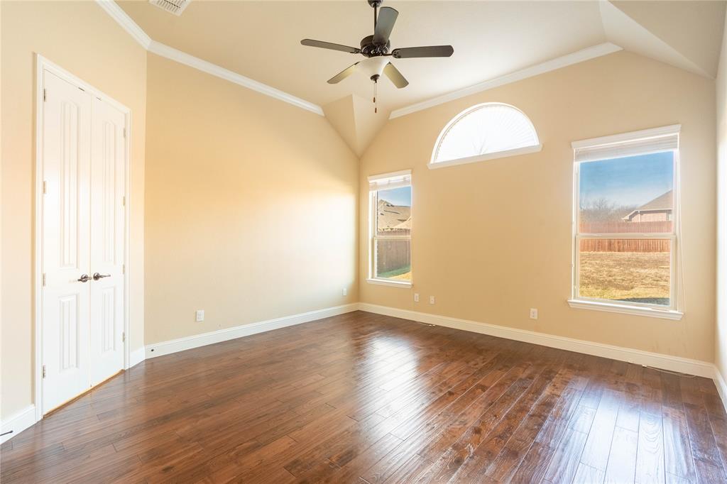 9101 Waters Lane Rowlett, TX 75089 - Photo 18 of 34 a view of an empty room with wooden floor and a window