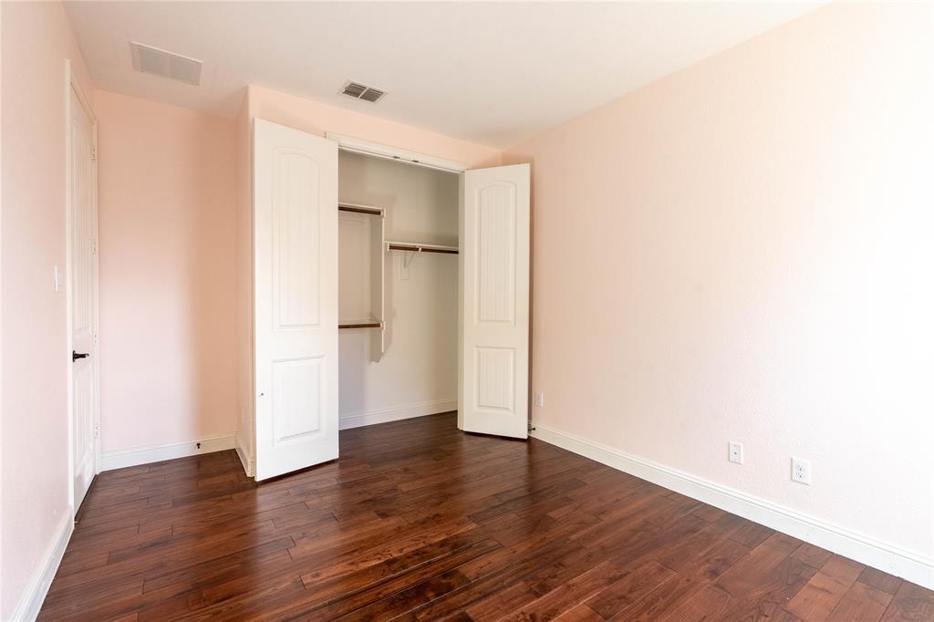 9101 Waters Lane Rowlett, TX 75089 - Photo 26 of 34 a view of empty room with wooden floor