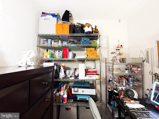 a view of storage and utility room with a window