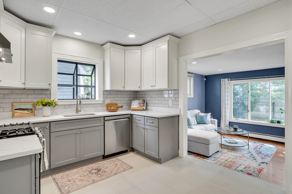 62 Florence Road Waltham, MA 02453 - Photo 11 of 42 a kitchen that has a sink and a stove in it