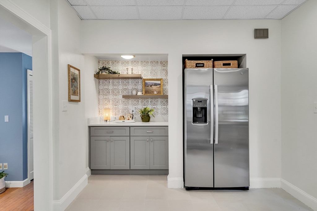 62 Florence Road Waltham, MA 02453 - Photo 15 of 42 a kitchen with stainless steel appliances granite countertop a refrigerator and a sink