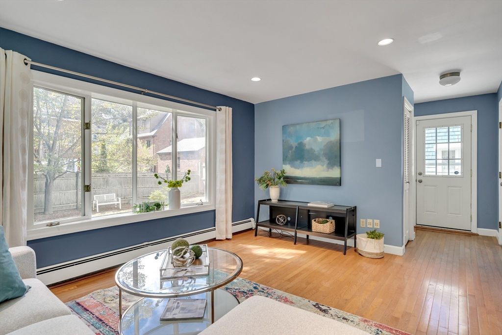 62 Florence Road Waltham, MA 02453 - Photo 17 of 42 a dining room with wooden floor and a table