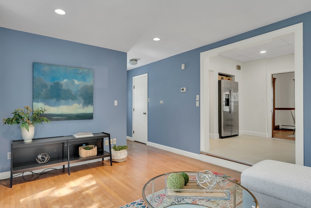62 Florence Road Waltham, MA 02453 - Photo 18 of 42 a living room with furniture and a flat screen tv