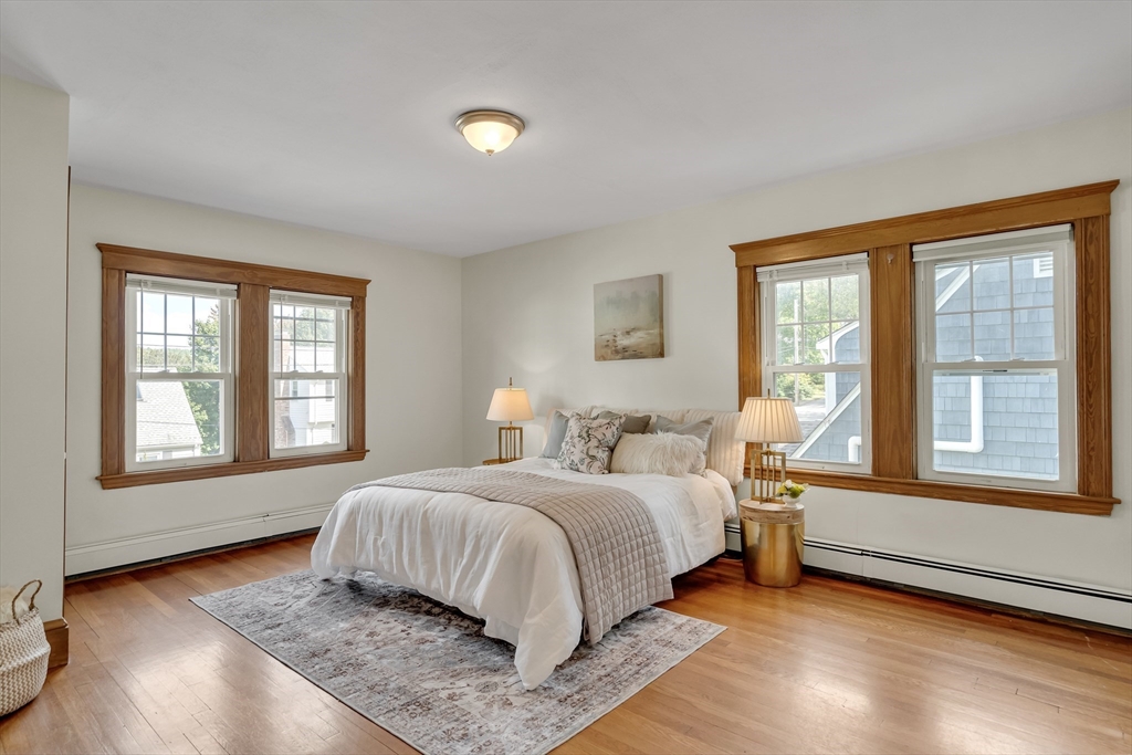 62 Florence Road Waltham, MA 02453 - Photo 22 of 42 a bedroom with a bed and a large window