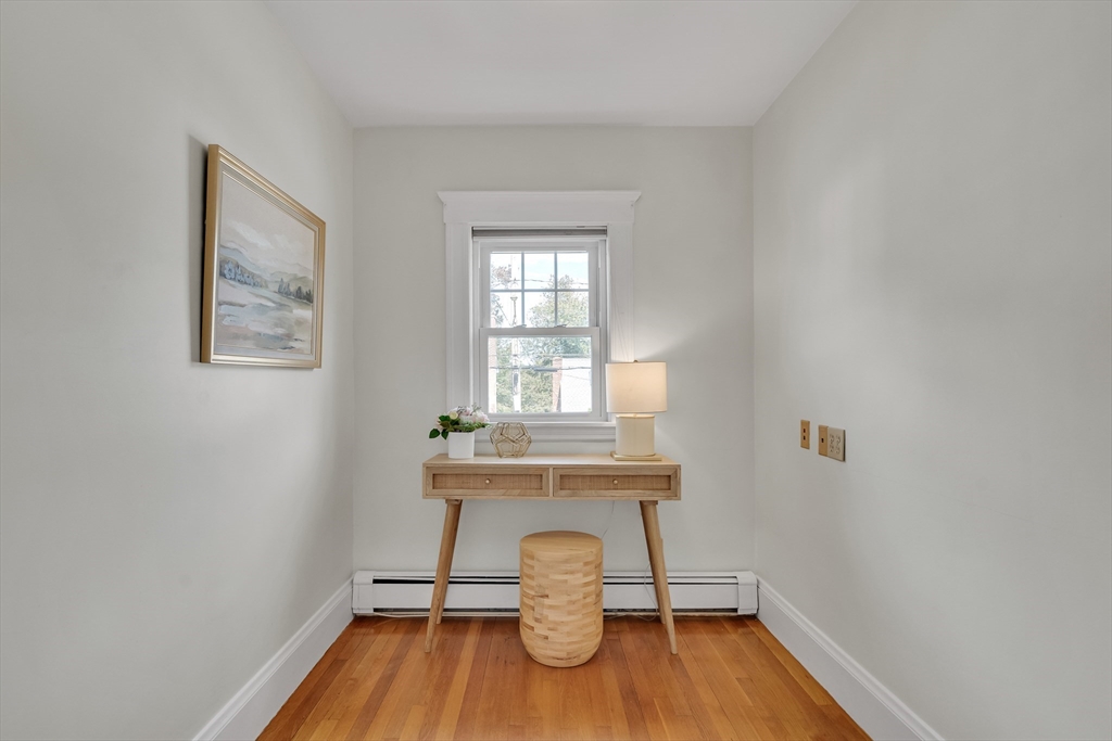 62 Florence Road Waltham, MA 02453 - Photo 26 of 42 a view of a room that has a bench and a window