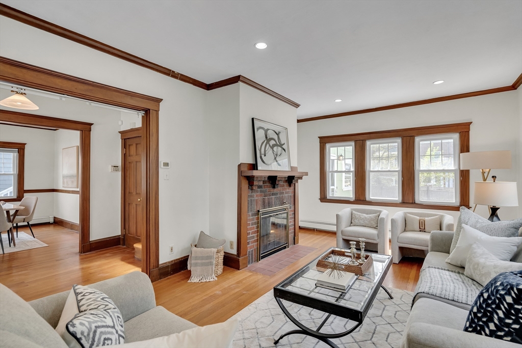 62 Florence Road Waltham, MA 02453 - Photo 3 of 42 a living room with furniture and a flat screen tv