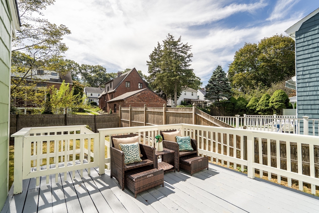 62 Florence Road Waltham, MA 02453 - Photo 34 of 42 a view of a chairs and table on the roof deck