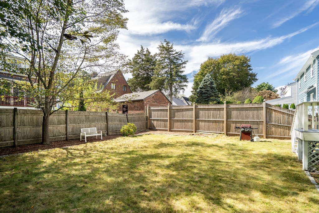 62 Florence Road Waltham, MA 02453 - Photo 37 of 42 a swimming pool with trees in front of it
