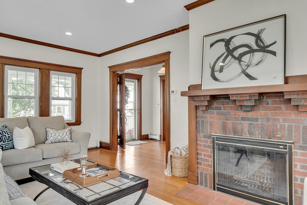 62 Florence Road Waltham, MA 02453 - Photo 4 of 42 a living room with furniture a rug and a fireplace