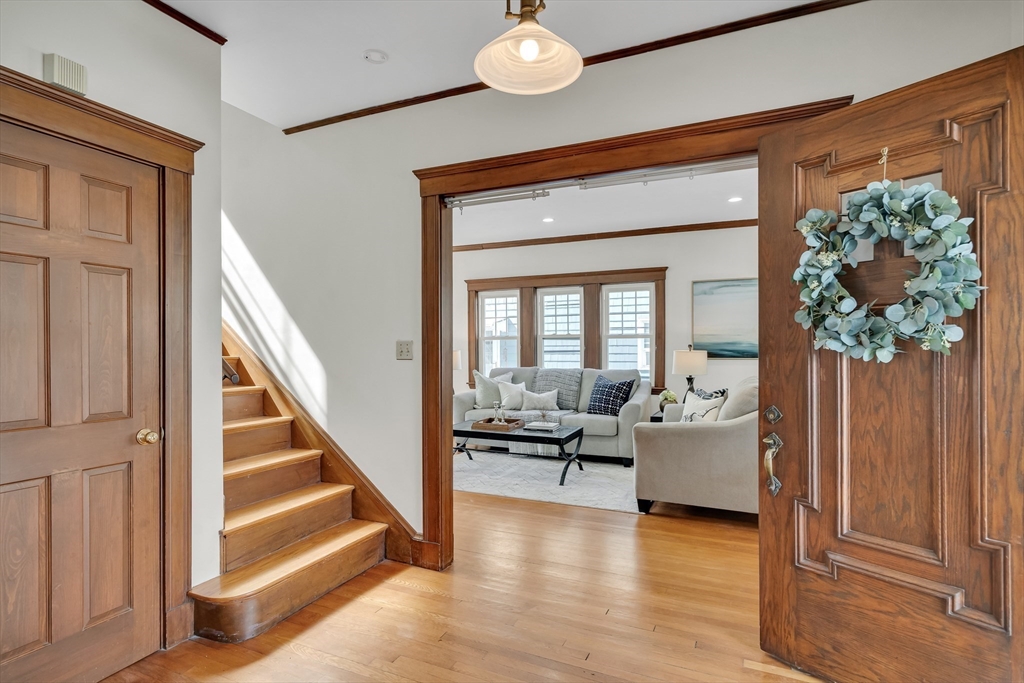 62 Florence Road Waltham, MA 02453 - Photo 5 of 42 a living room with wooden floor furniture and a potted plant