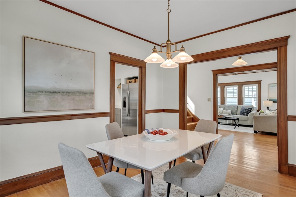 62 Florence Road Waltham, MA 02453 - Photo 9 of 42 a view of a dining room with furniture wooden floor and chandelier