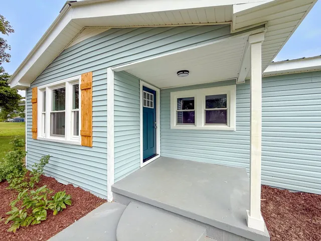 a front view of a house with a garage