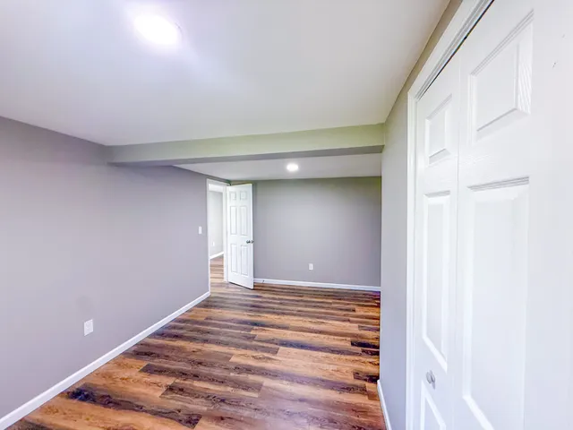 a view of a room with a staircase and white walls