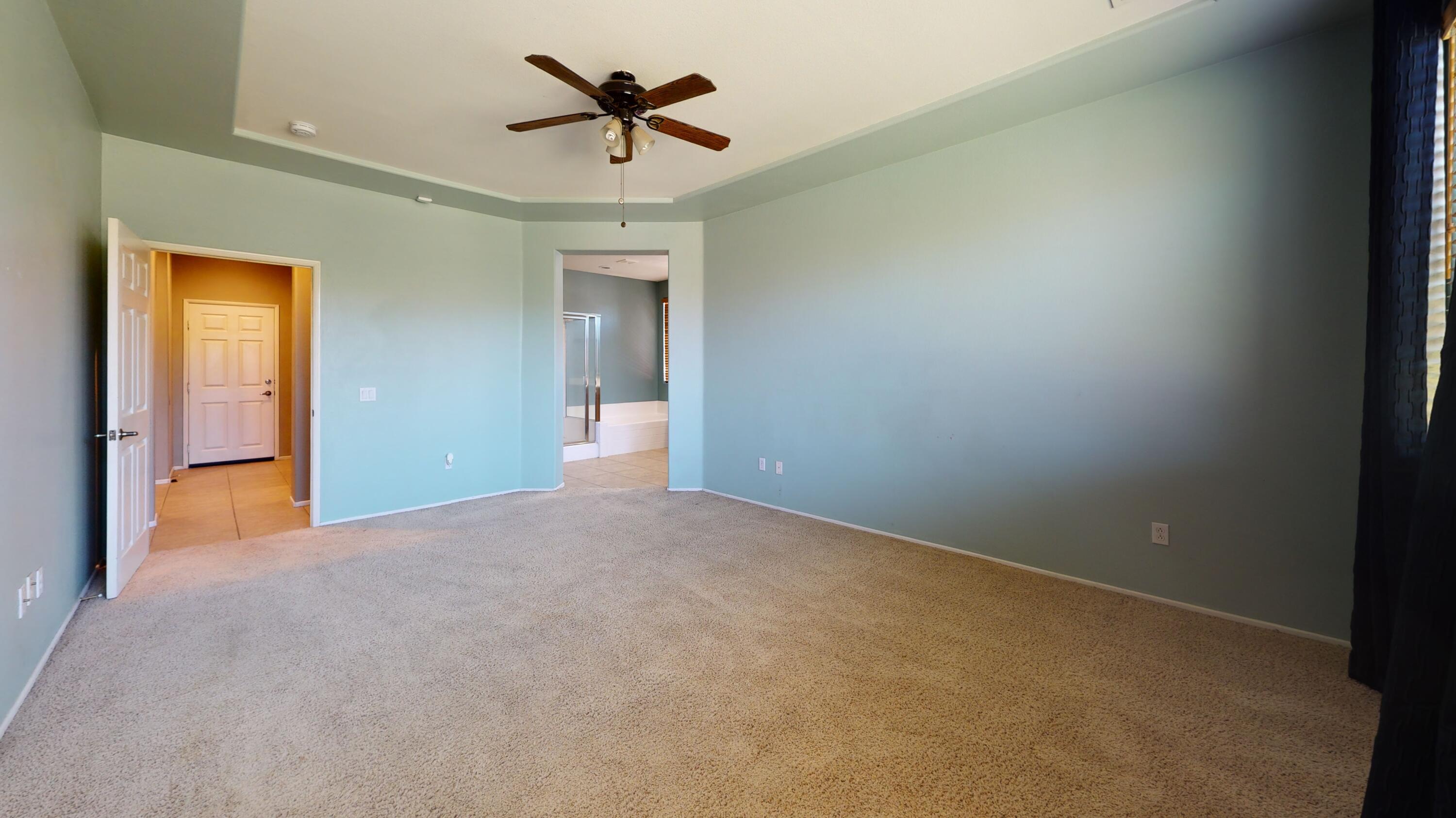 82712 Kyle Drive Indio, CA 92203 - Photo 11 of 29 a view of a room with a ceiling fan and a window