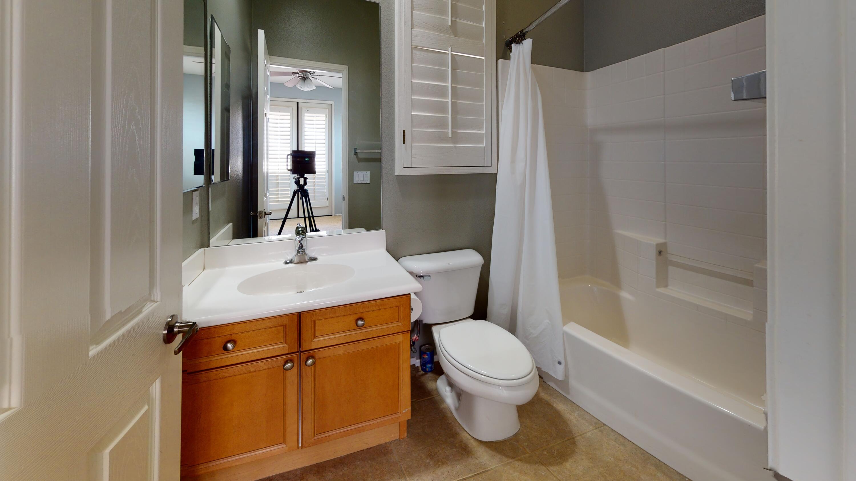 82712 Kyle Drive Indio, CA 92203 - Photo 14 of 29 a bathroom with a granite countertop sink toilet and shower