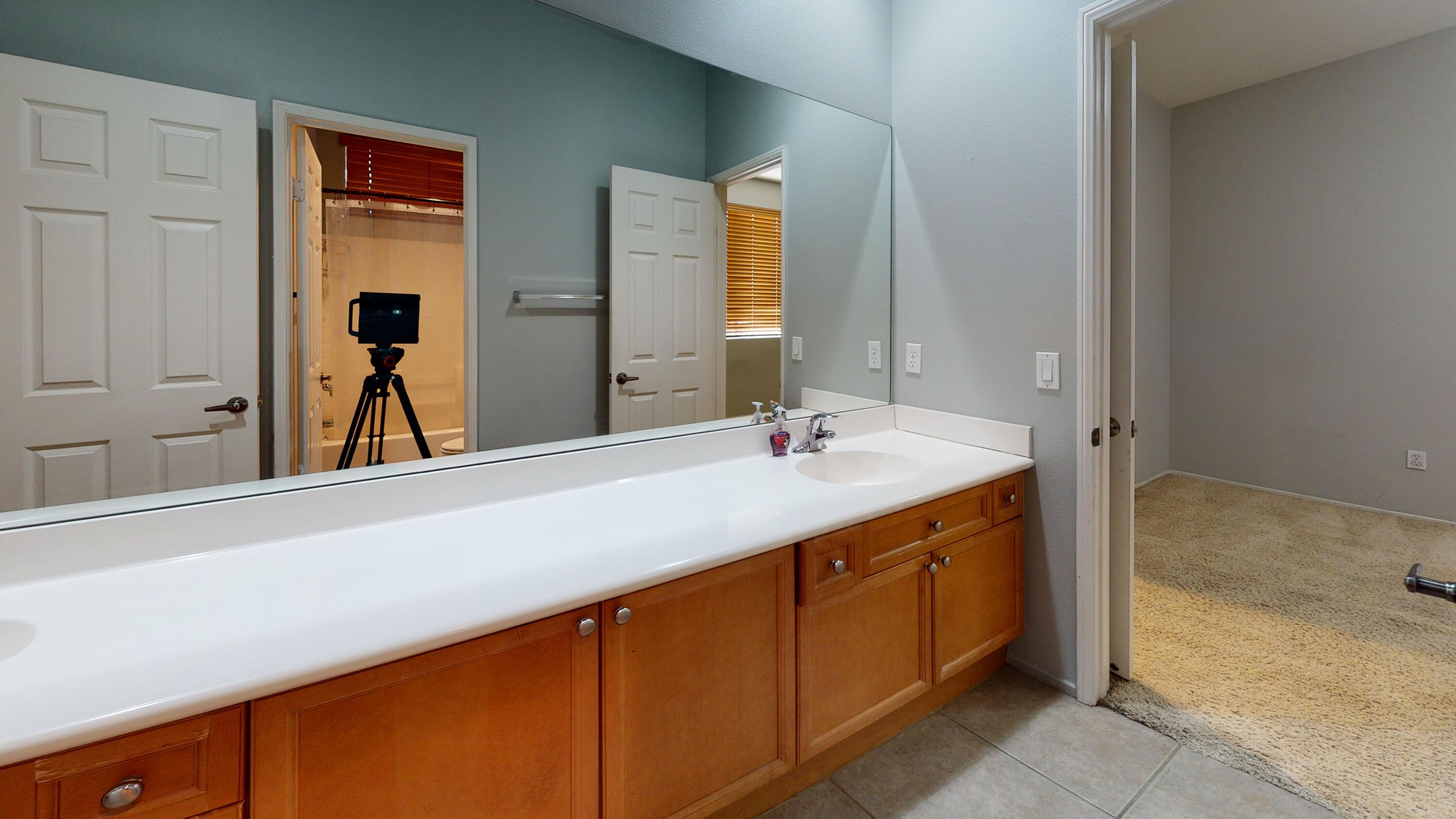 82712 Kyle Drive Indio, CA 92203 - Photo 15 of 29 a bathroom with a sink and a mirror