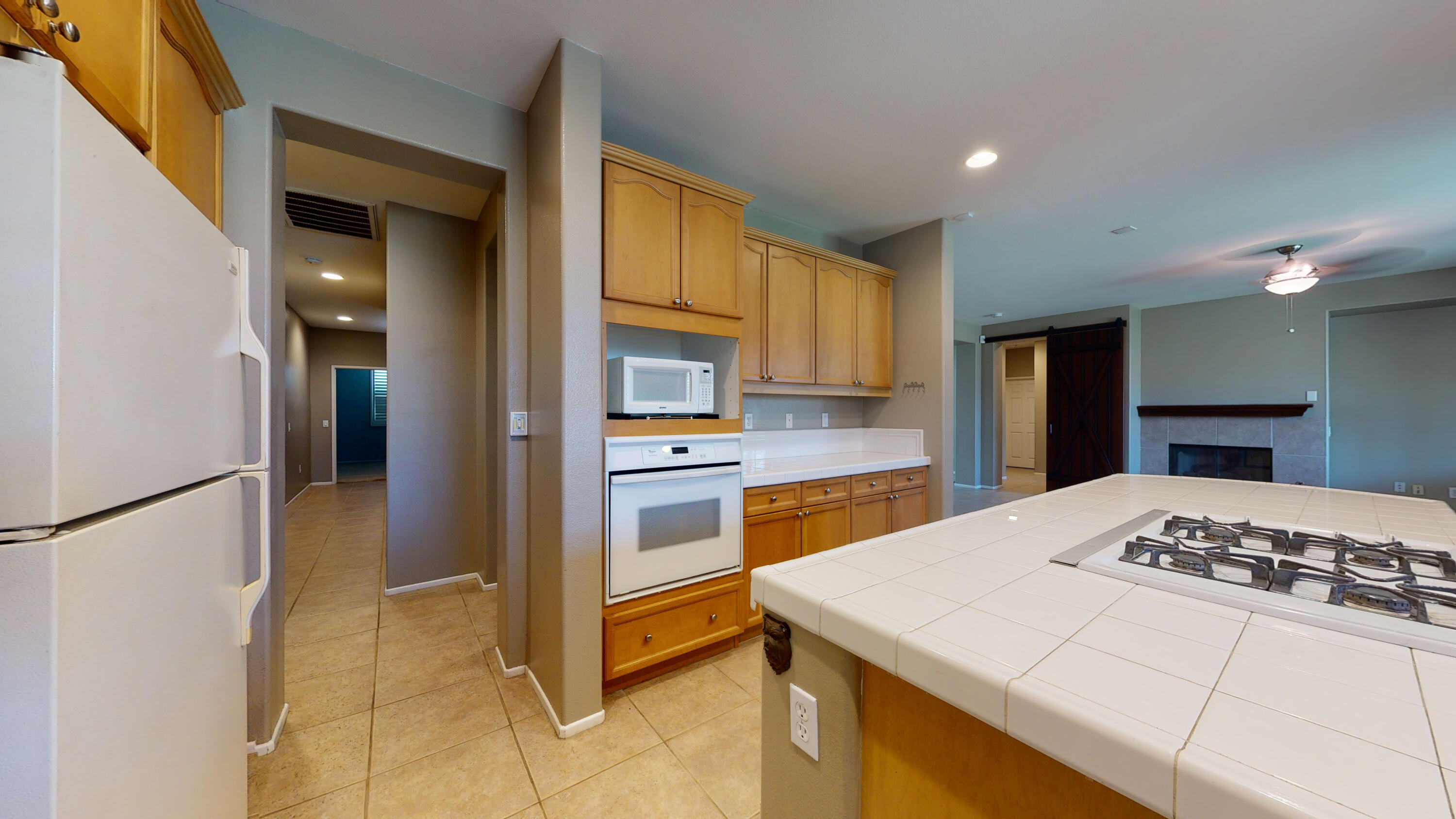 82712 Kyle Drive Indio, CA 92203 - Photo 16 of 29 a kitchen view with appliances and cabinets