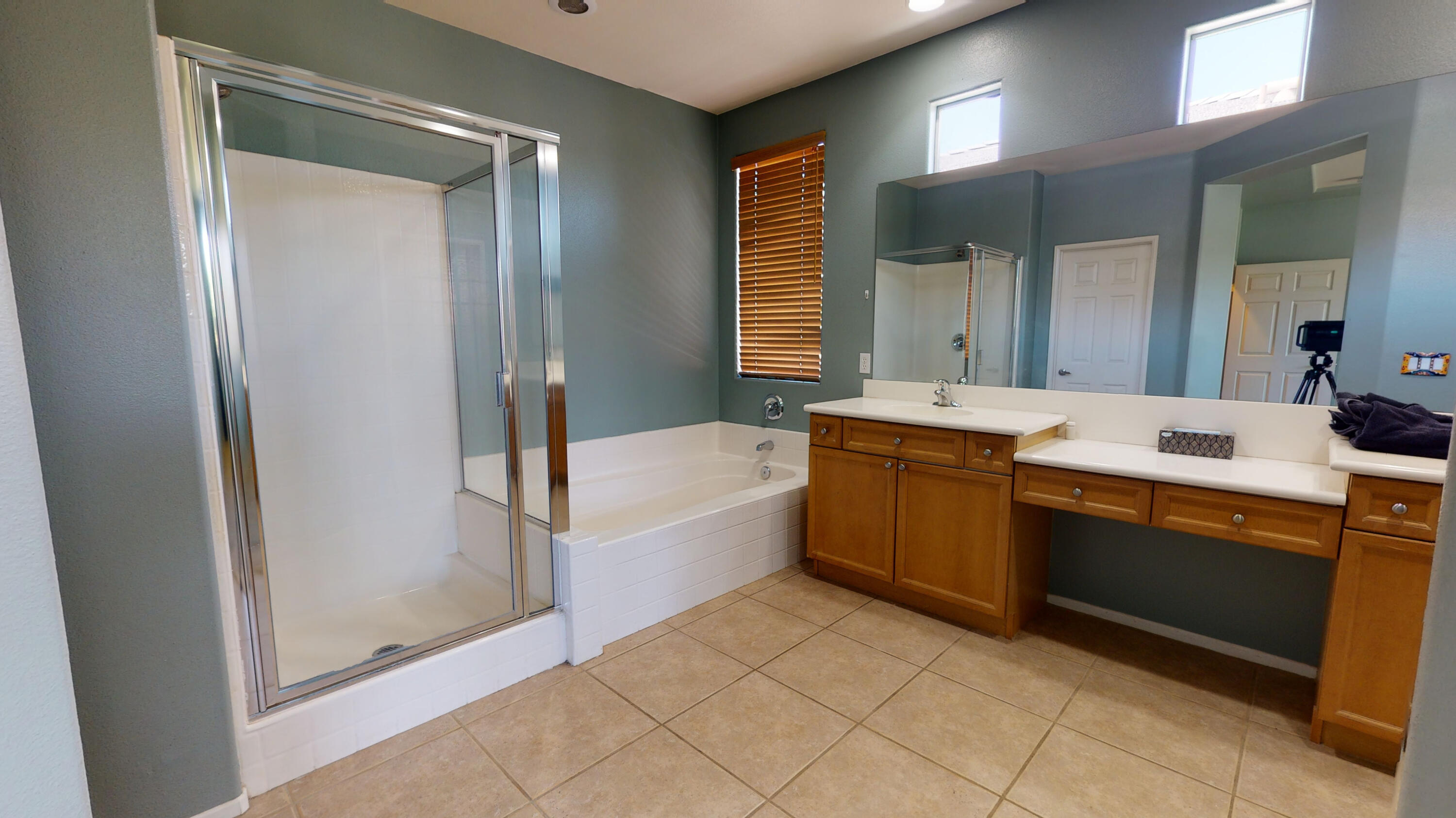 82712 Kyle Drive Indio, CA 92203 - Photo 22 of 29 a large bathroom with a double vanity sink mirror and bathtub