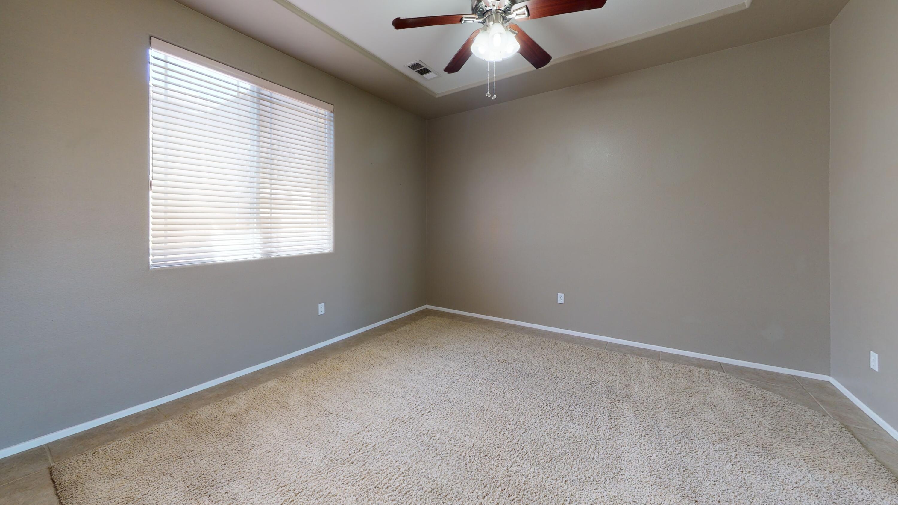 82712 Kyle Drive Indio, CA 92203 - Photo 7 of 29 an empty room with a window
