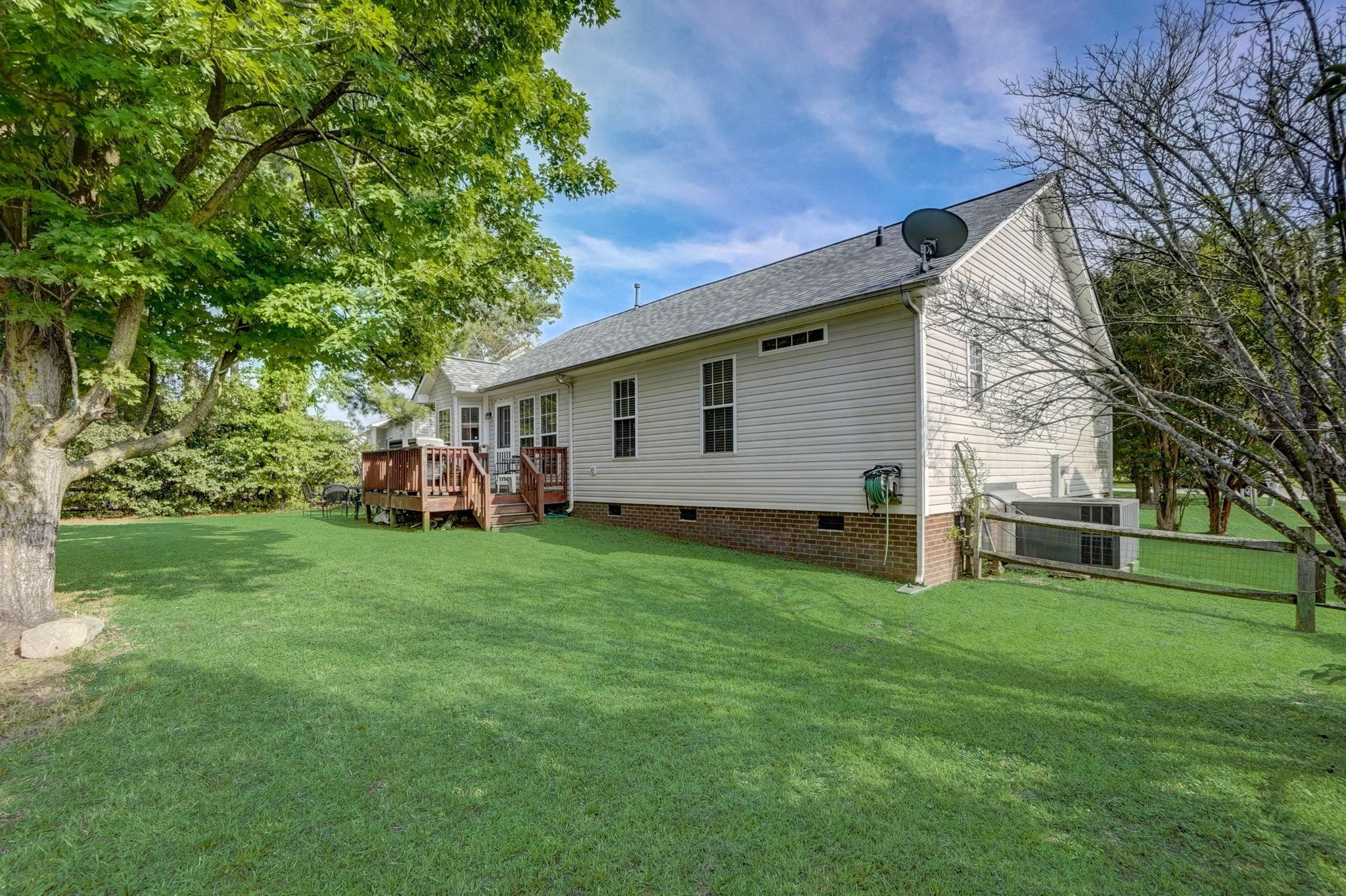 7133 Spanglers Spring Way Raleigh, NC 27610 - Photo 16 of 17 a view of a house with a backyard