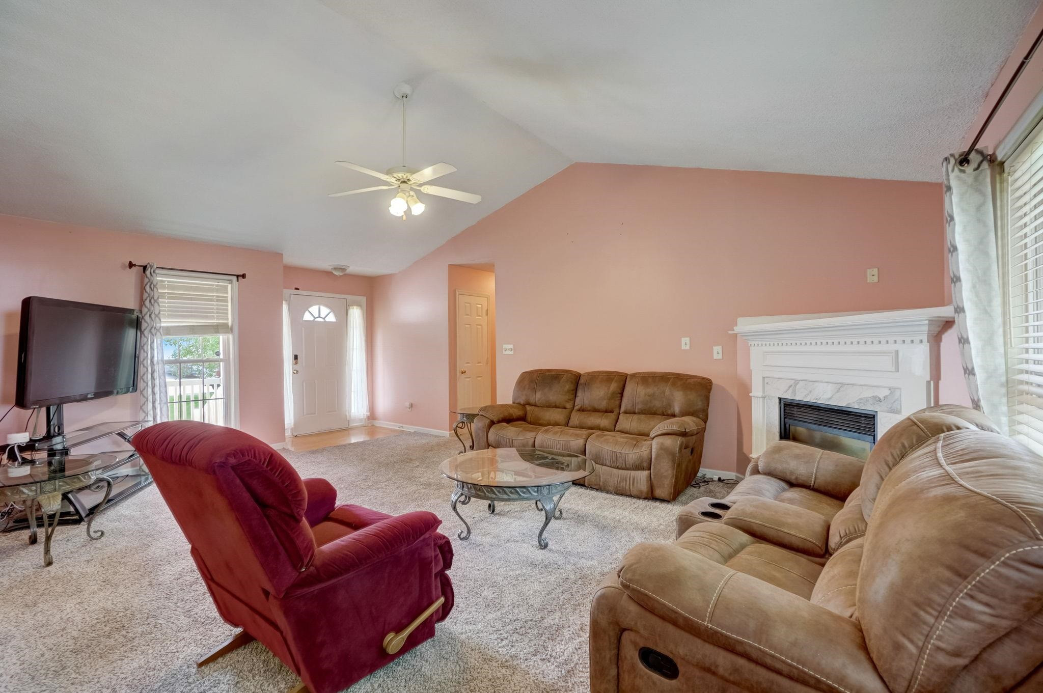 7133 Spanglers Spring Way Raleigh, NC 27610 - Photo 4 of 17 a living room with furniture and a fireplace